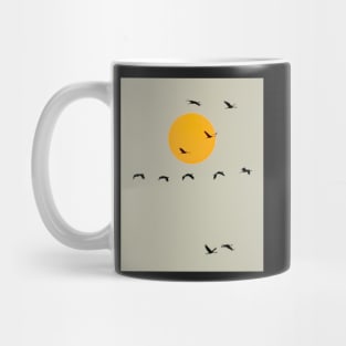 Common Cranes Flying in Front of Orange Setting Sun Mug